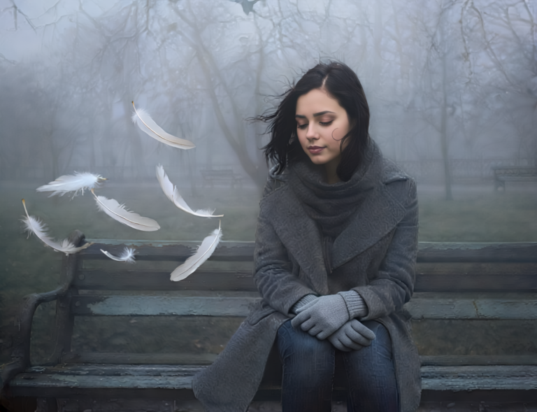 Mujer sentada en un parque mientras plumas son llevadas por el viento, transmitiendo liberación y desapego, inspirado en el poema "Dejé soltar esas alas" de Yelsi Vega.